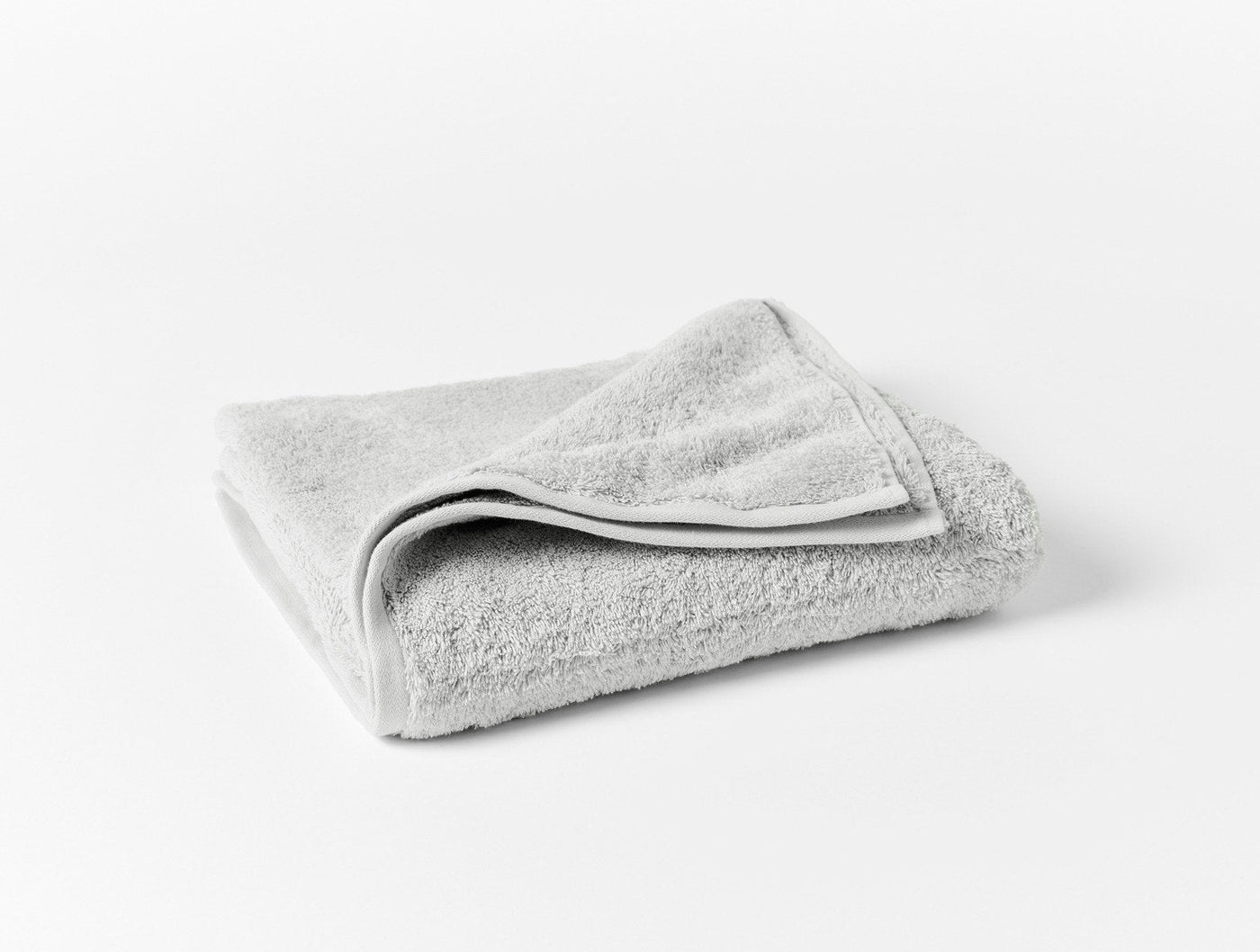 Coyuchi Cloud Loom wash cloth folded, silver grey organic cotton terry.