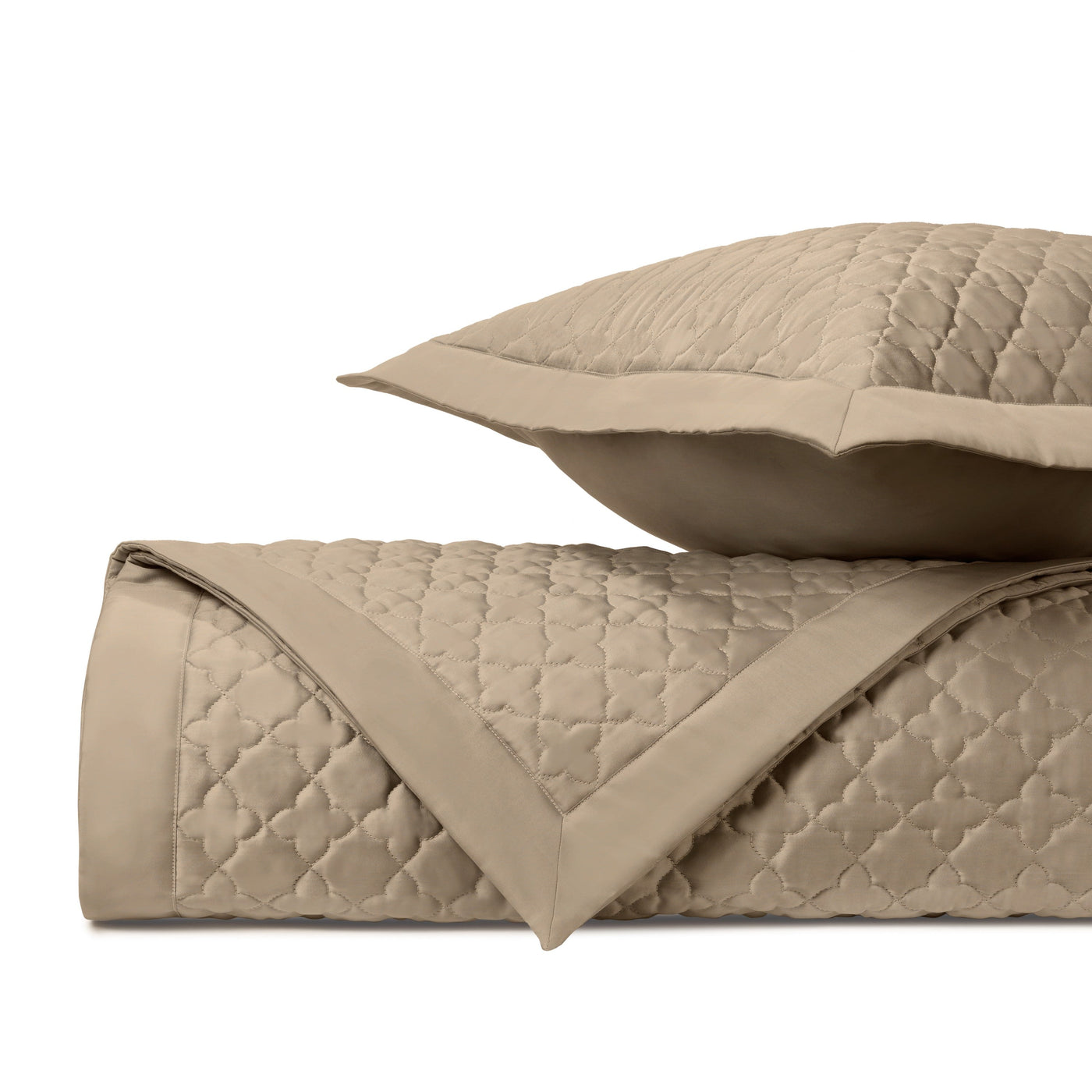 Close-up of Home Treasures Clover quilted texture in camel with lattice stitching pattern.