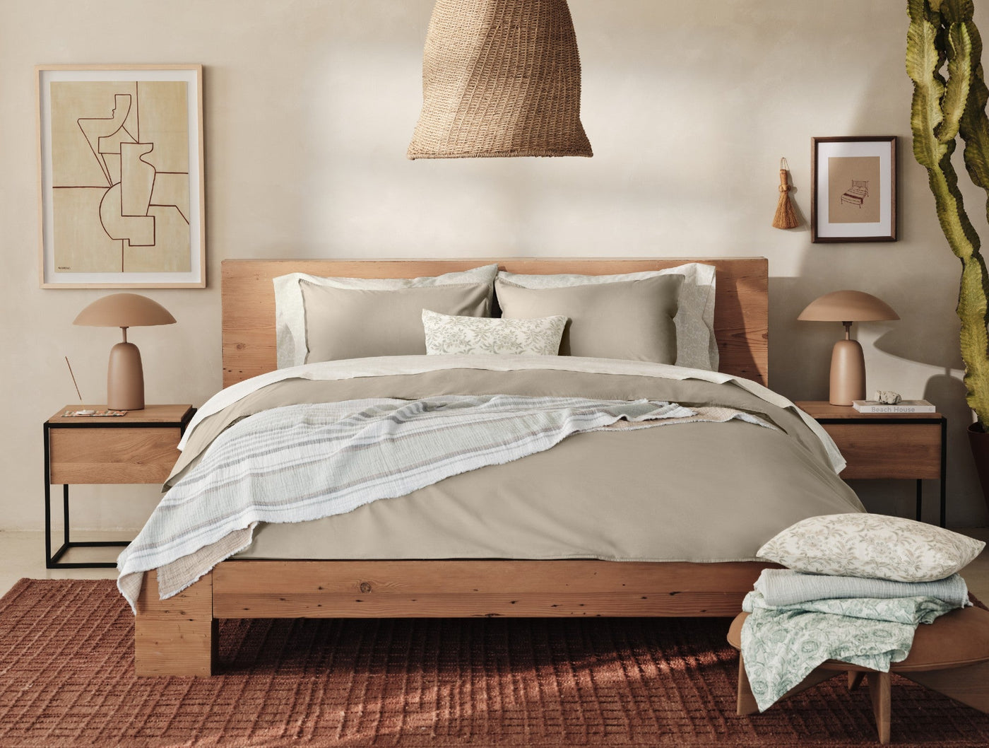 Coyuchi Crinkled Percale sham styled on a bed with neutral linen bedding.