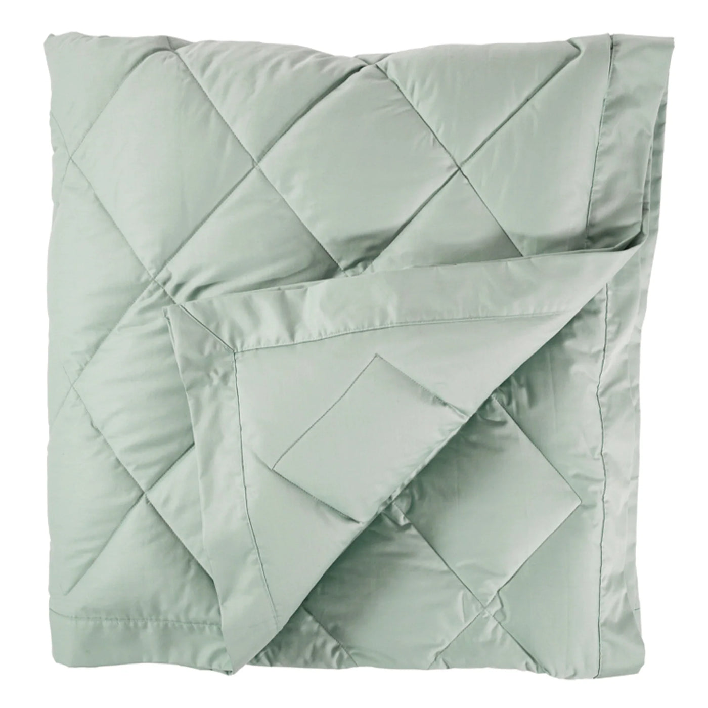 Close-up of sage green diamond-quilted down blanket with folded corner detail.