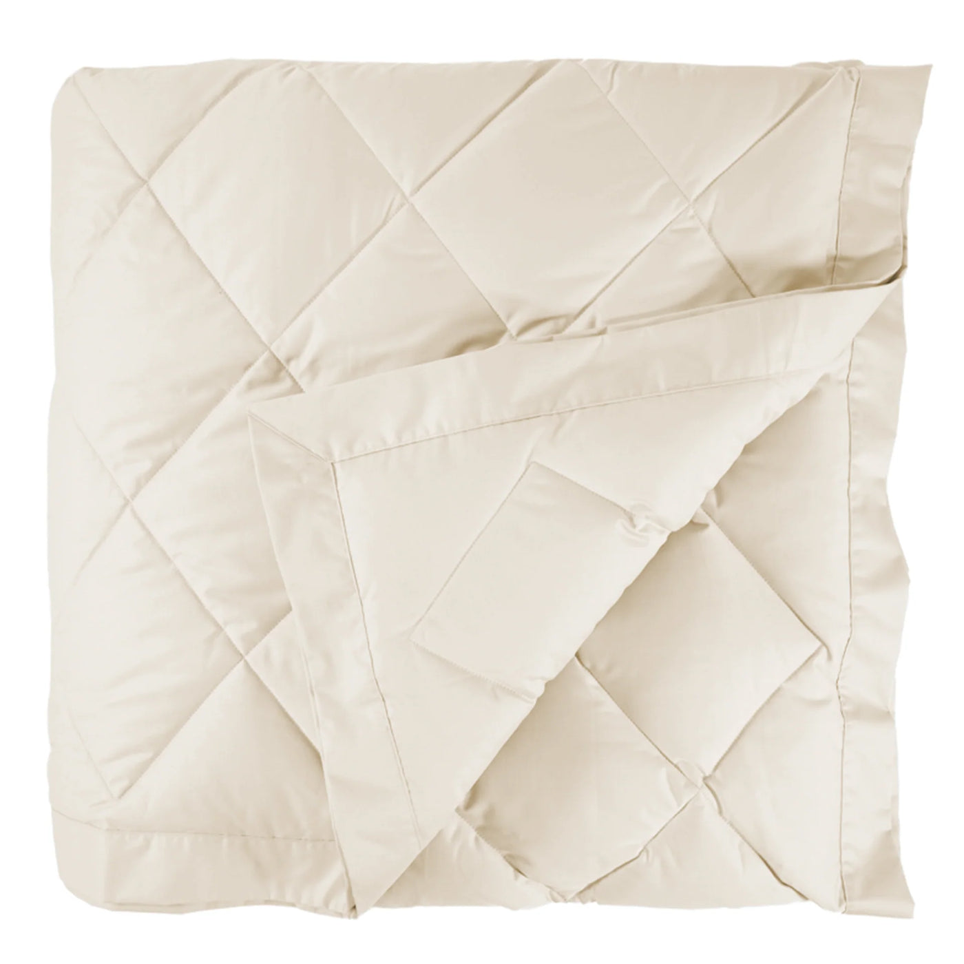 Corner fold detail revealing ivory quilted diamond pattern on Scandia Home down blanket.