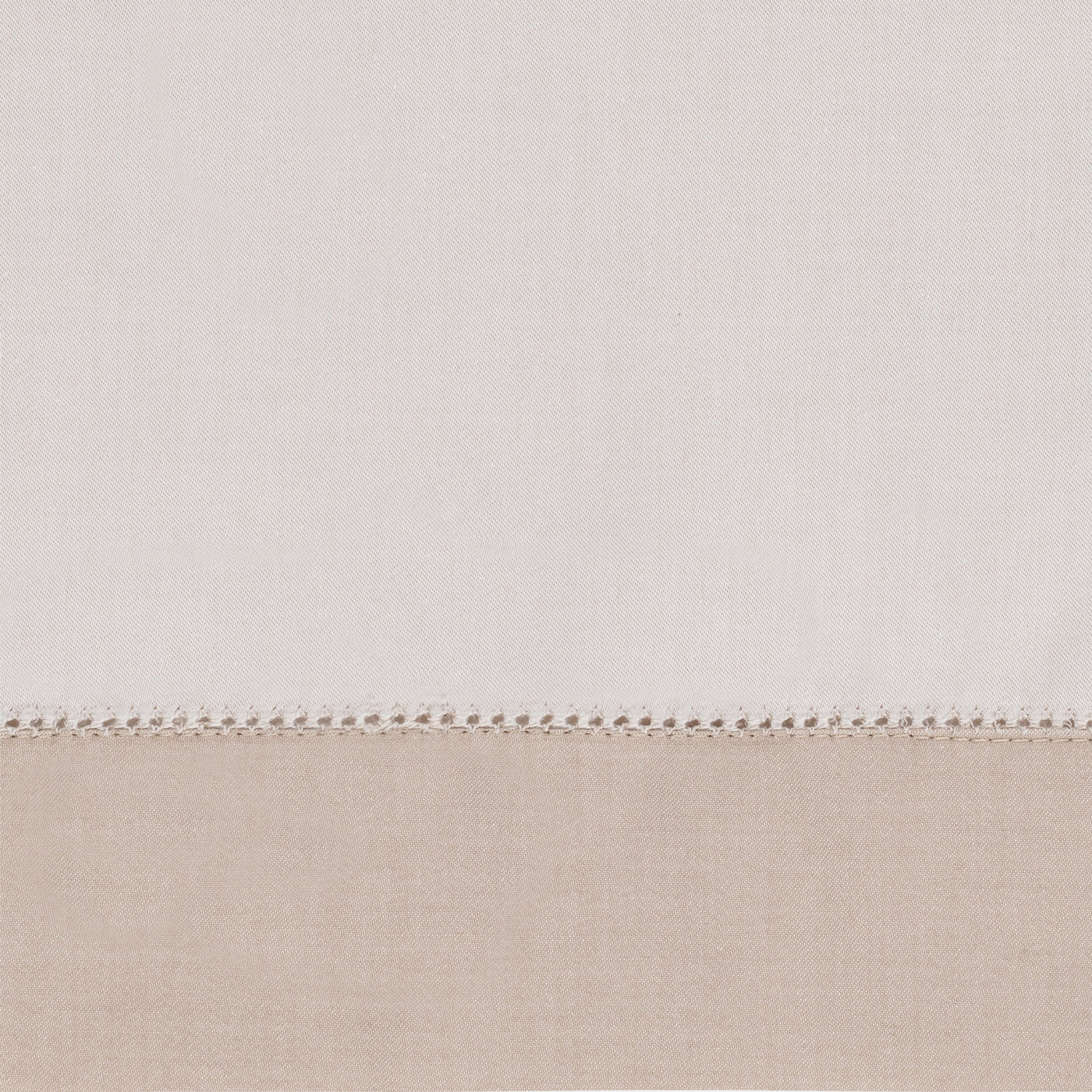 Close-up of ivory and sand linen fabric with delicate hemstitch border detail.