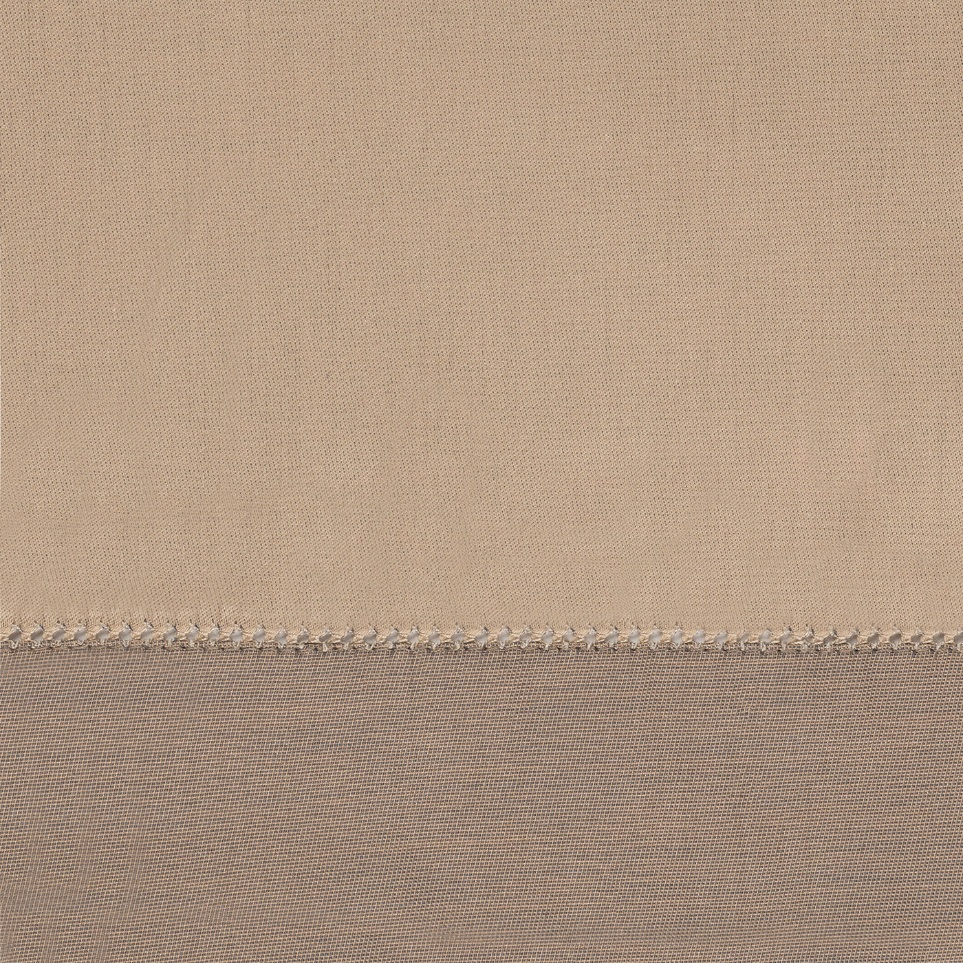 Close-up of contrast hem detail with whipstitch trim in champagne and taupe linen.