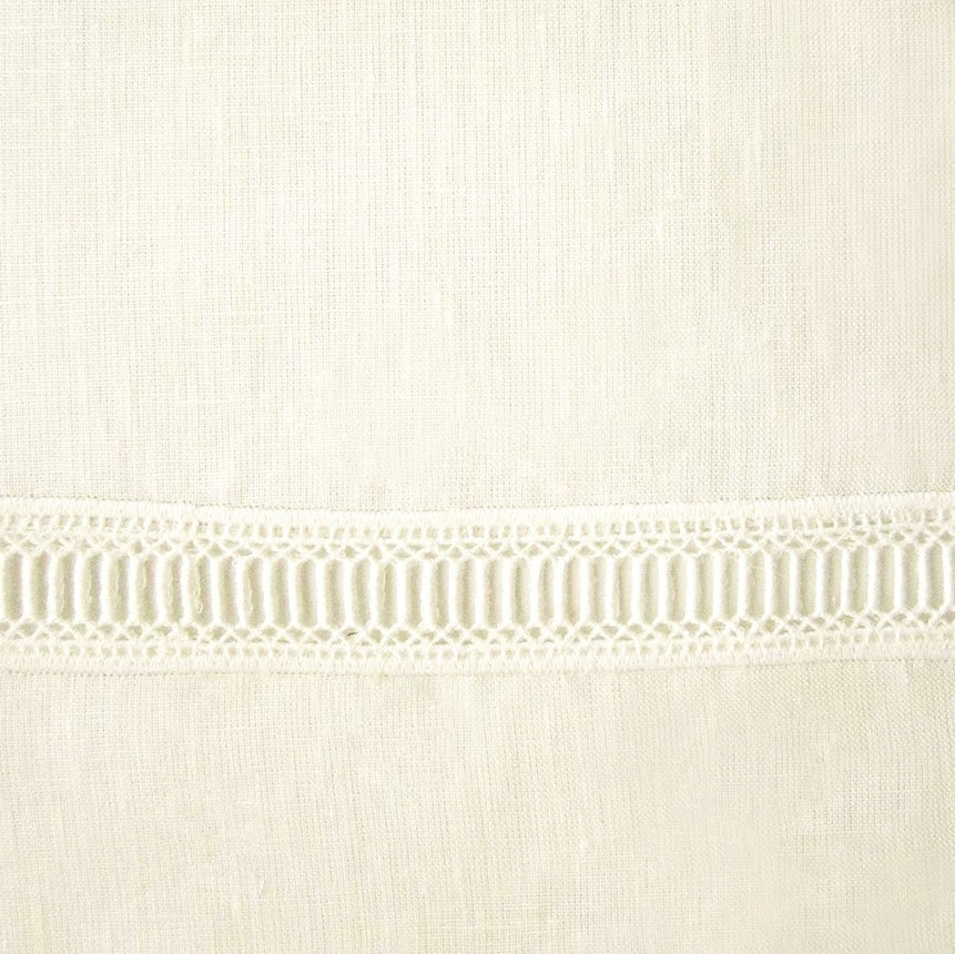 Close-up of ivory linen weave with delicate ladder lace trim detail.