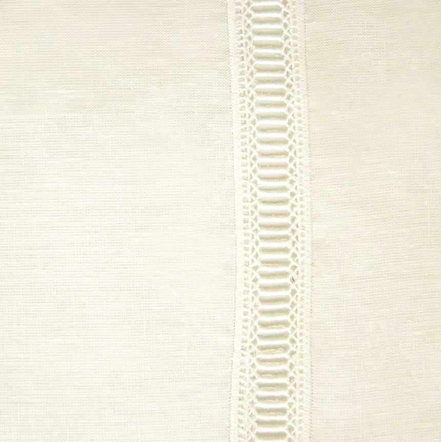 Close-up of ivory linen fingertip towel with vertical ladder lace trim detail.