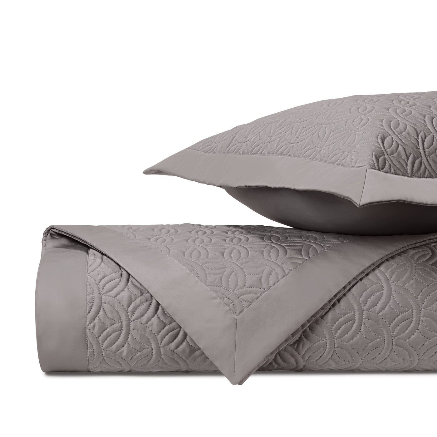 Close-up of Home Treasures Duomo quilted texture in warm grey.