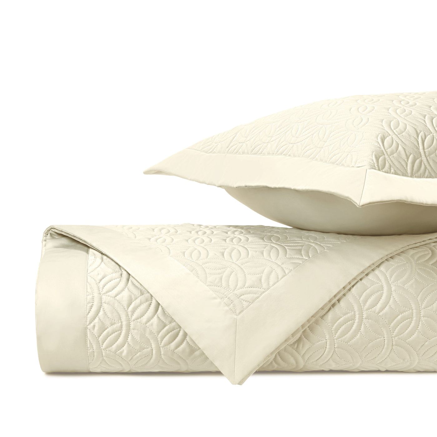 Close-up of Home Treasures Duomo ivory quilted texture with floral geometric pattern.