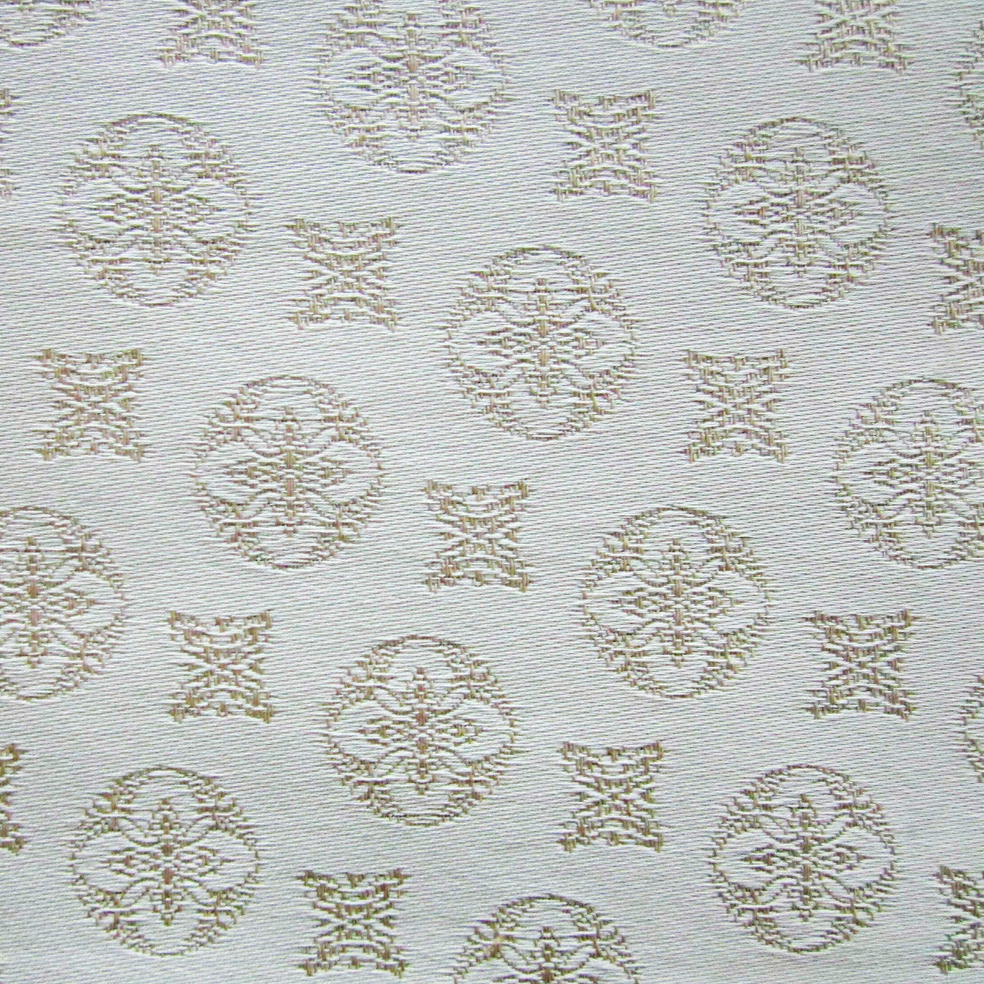 Close-up of Duomo fabric weave showing tonal champagne medallion and geometric motifs on ivory ground.