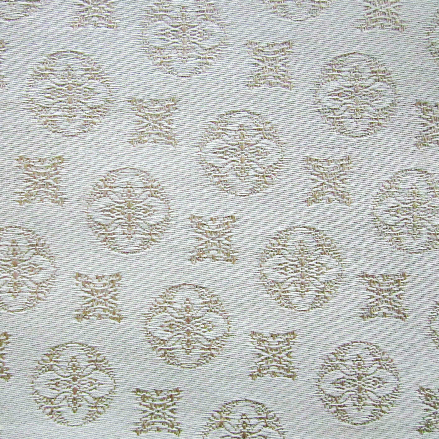 Close-up of Home Treasures Duomo fabric with gold medallion pattern on ivory.
