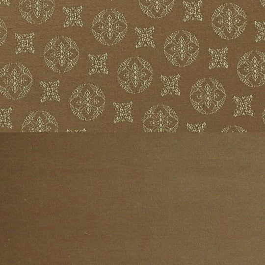Close-up of Home Treasures Duomo flat sheet hem, bronze medallion jacquard against solid mocha.