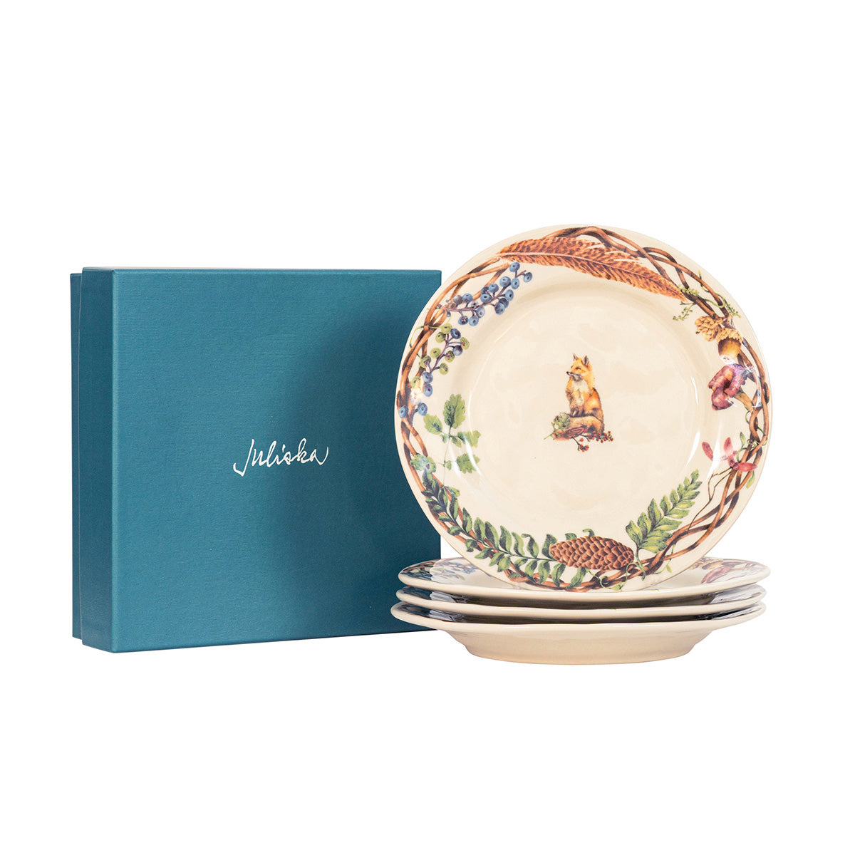Juliska Forest Walk animal salad plates stacked beside a teal Juliska gift box