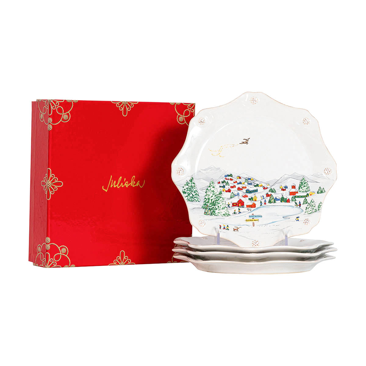 Stack of North Pole salad plates beside a red Juliska gift box