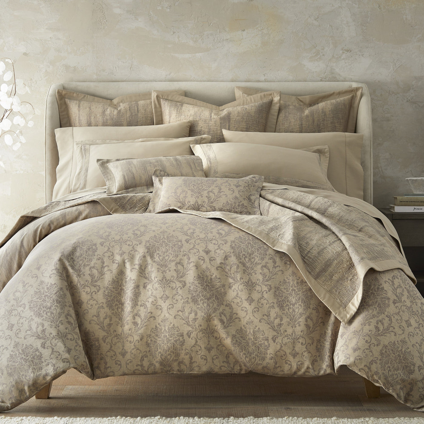 Home Treasures Eloise quilted coverlet in champagne damask on styled bed.