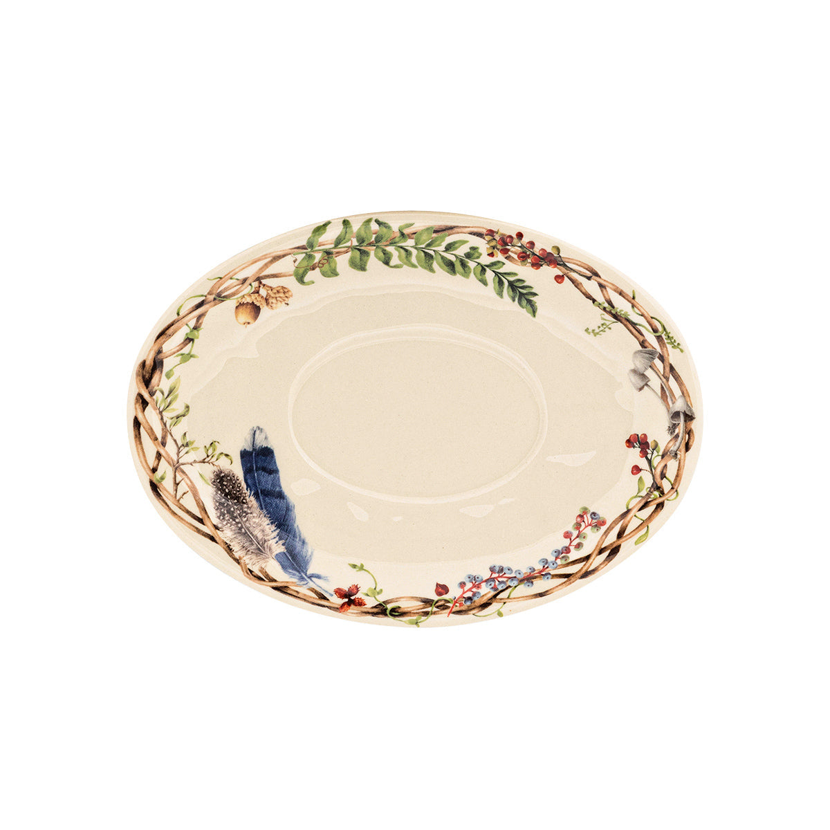 Juliska Forest Walk oval sauce boat stand with a wreath of twigs, ferns and a blue feather