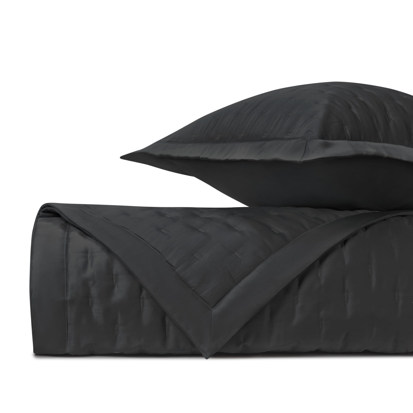 Close-up of Home Treasures Fil Coupé quilted coverlet and sham in black.