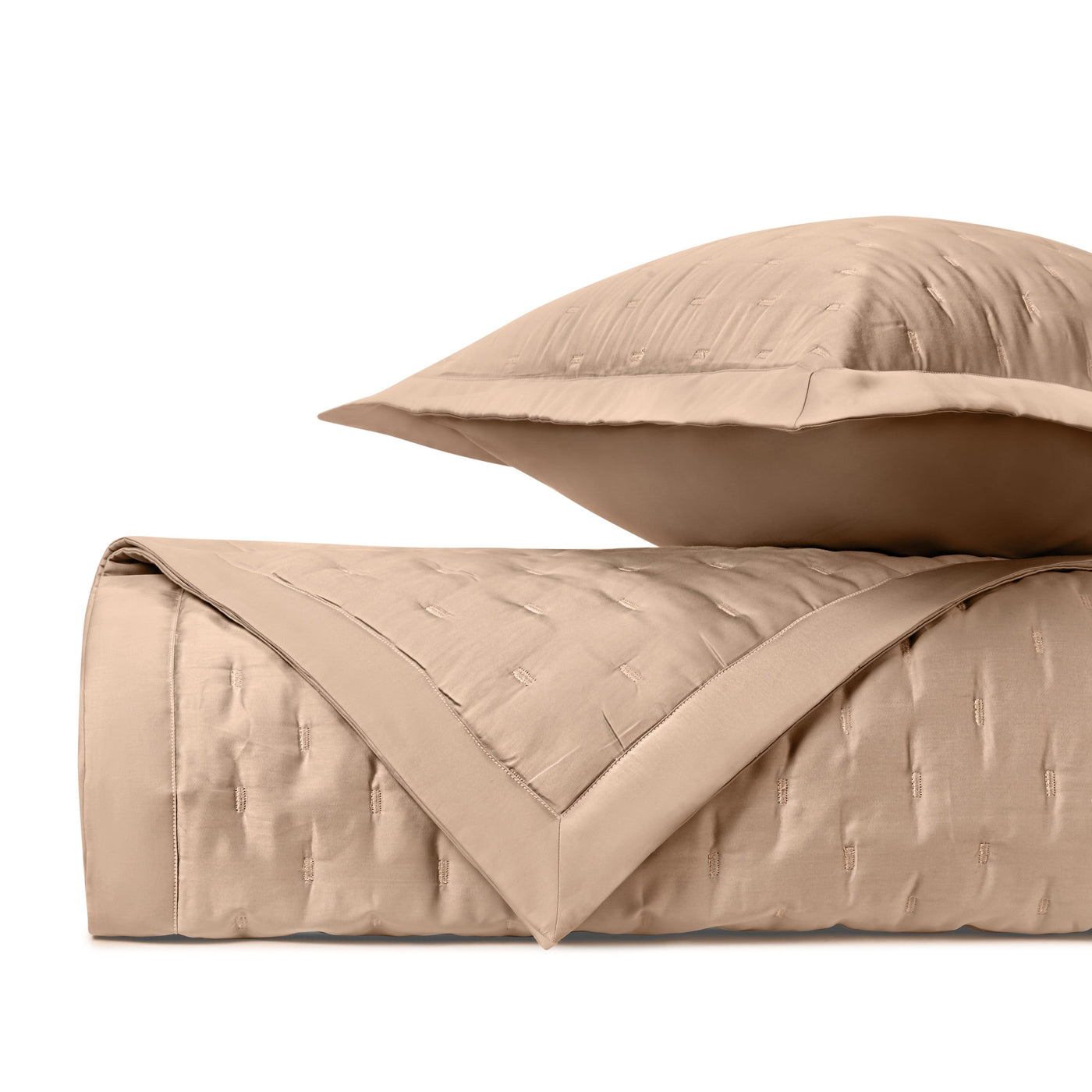Close-up of Home Treasures Fil Coupé quilted coverlet and sham in camel.