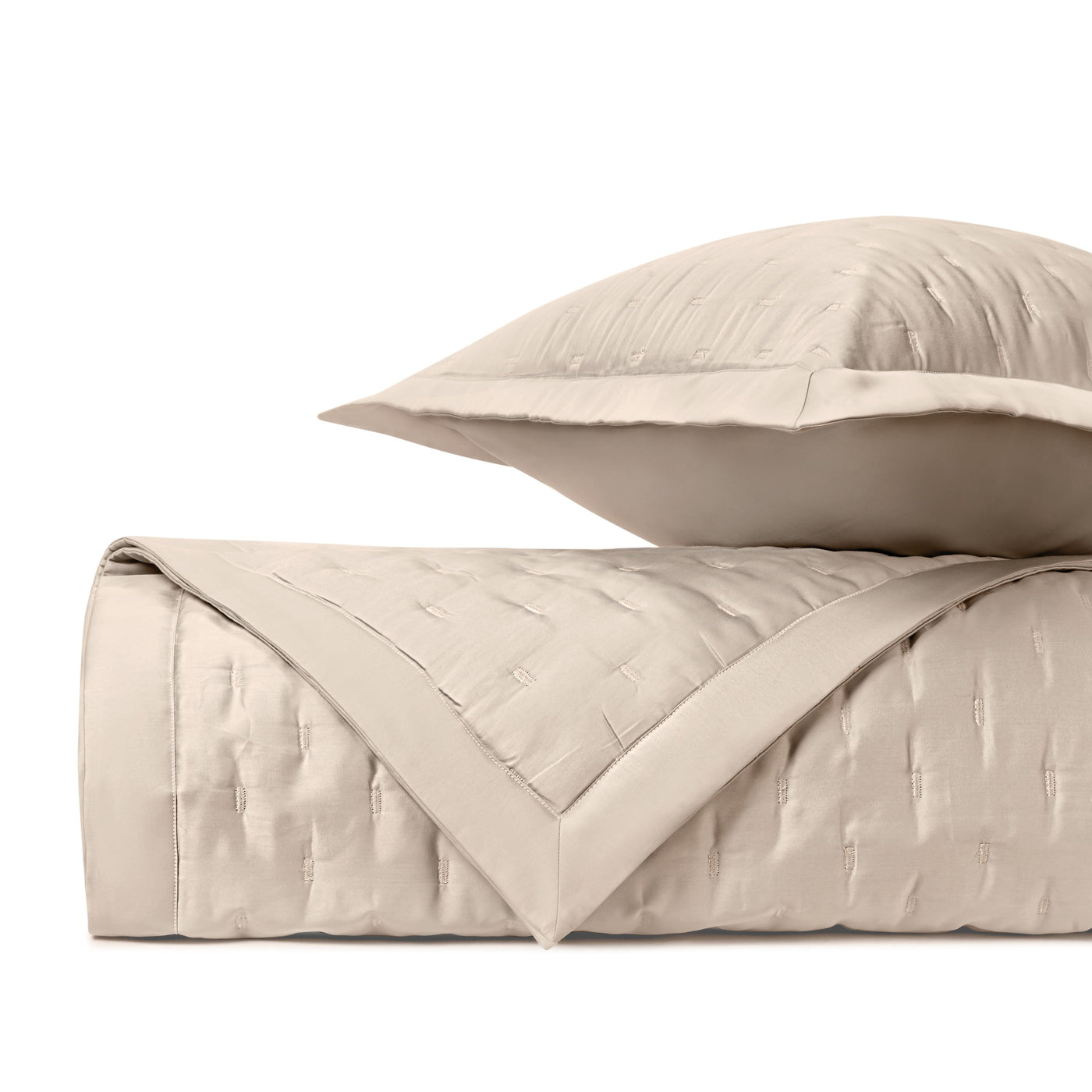 Close-up of Home Treasures Fil Coupé quilted texture in ivory with cut-fil pattern detail.