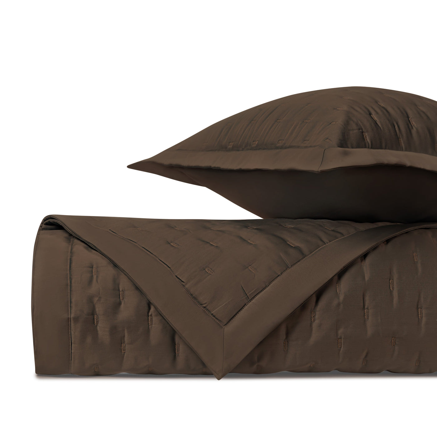 Close-up of Home Treasures Fil Coupé quilted texture in deep chocolate brown.