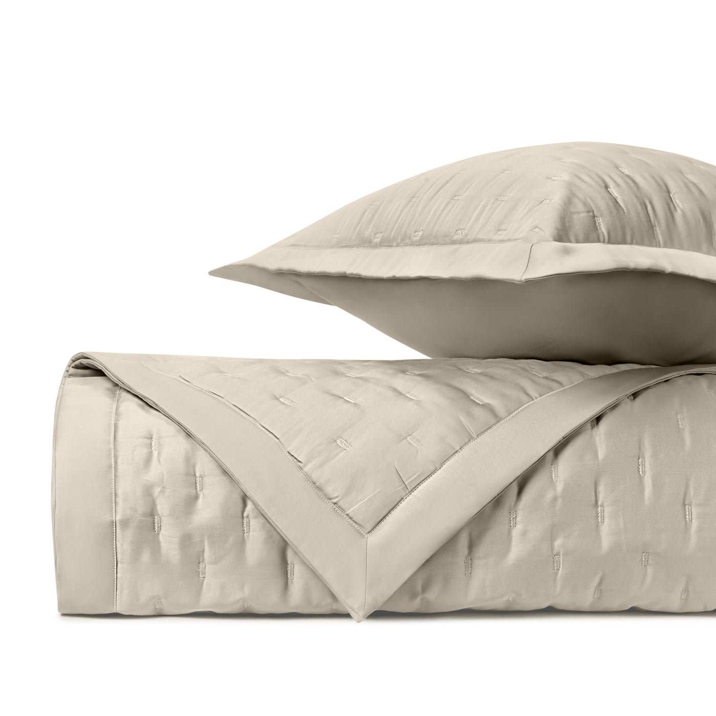 Close-up of Home Treasures Fil Coupé quilted texture in ivory with border detail.