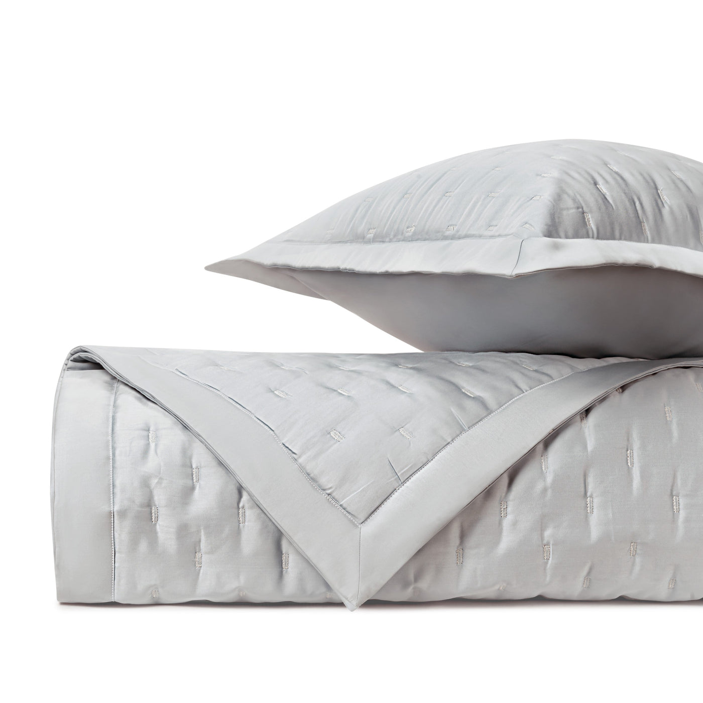 Close-up of Home Treasures Fil Coupé Modal quilted texture in silver with white border detail.