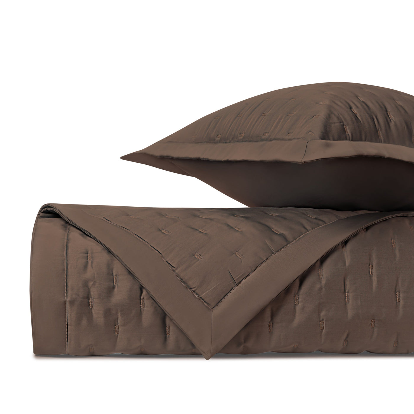 Close-up of Home Treasures Fil Coupé quilted coverlet and sham in mink.