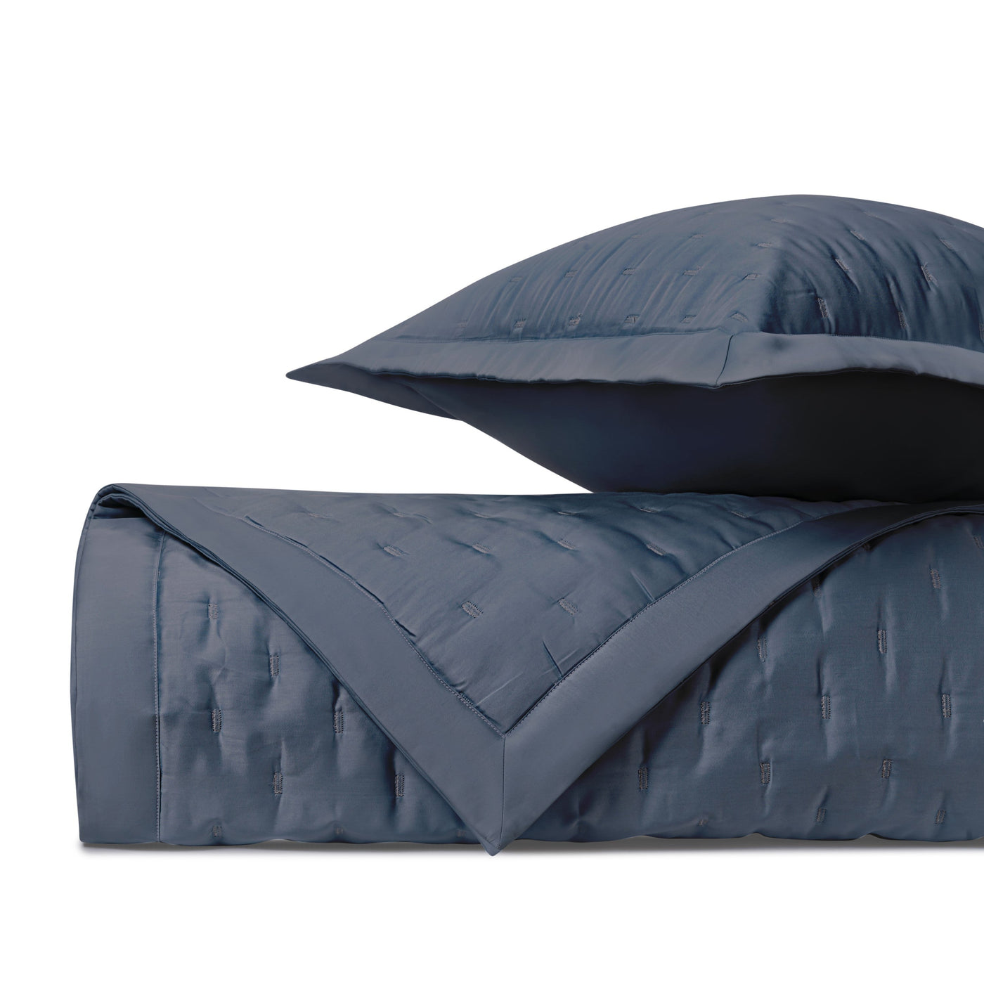 Close-up of Home Treasures Fil Coupé quilted texture in navy blue.