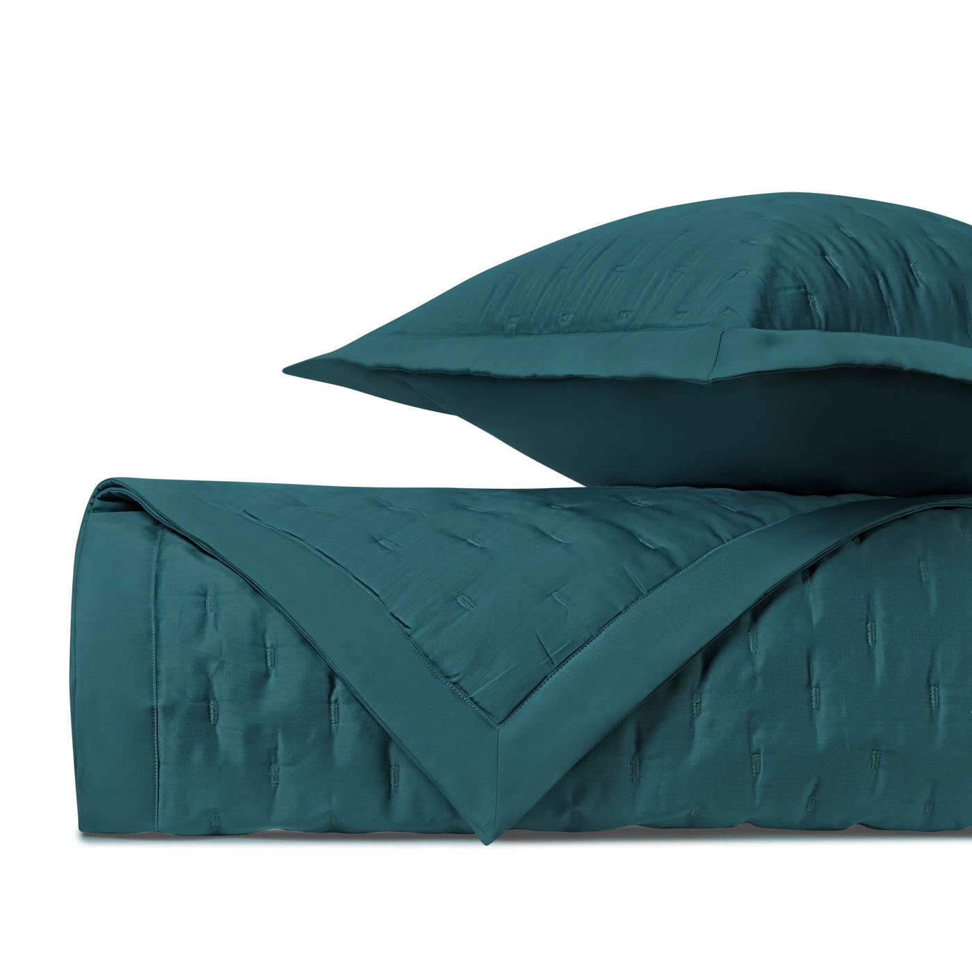 Close-up of Home Treasures Fil Coupé quilted texture in teal.