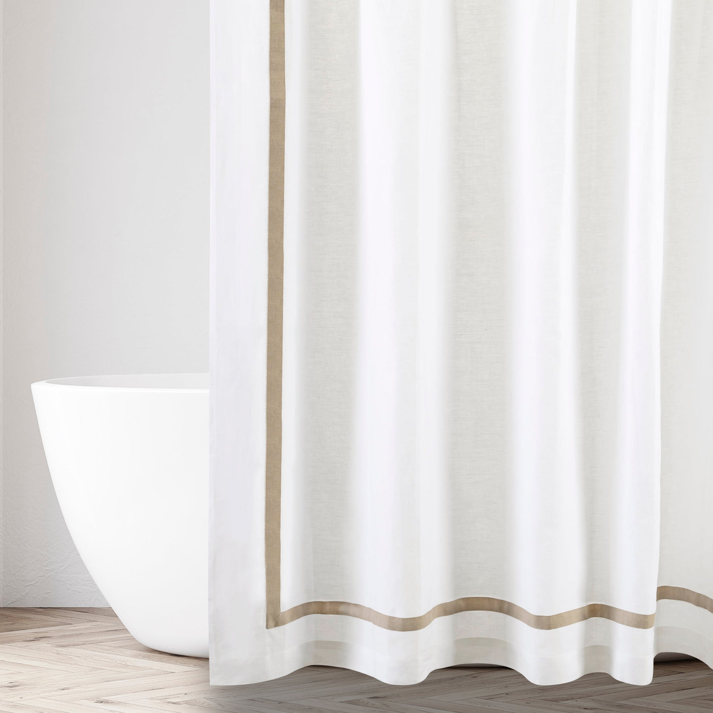 Close-up of white fabric with parallel tan grosgrain ribbon borders at edge and hem.