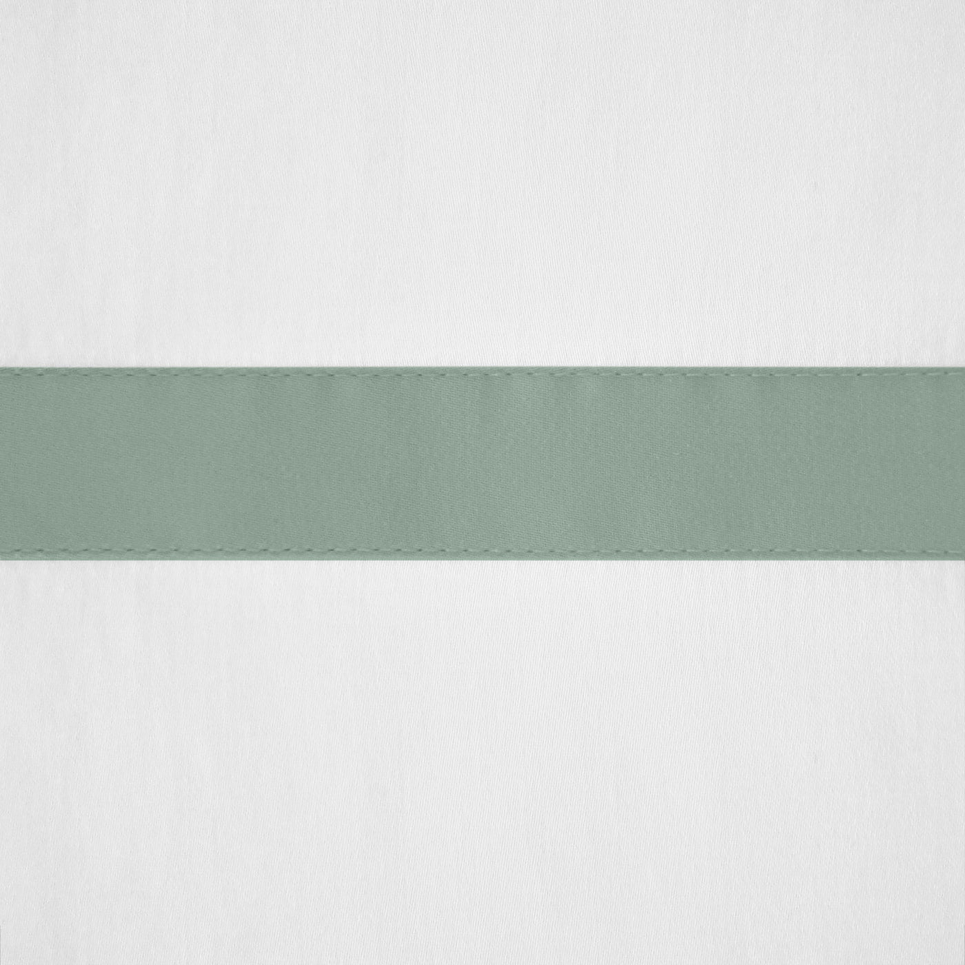 Close-up of sage green border stripe with topstitching detail on white cotton fabric.