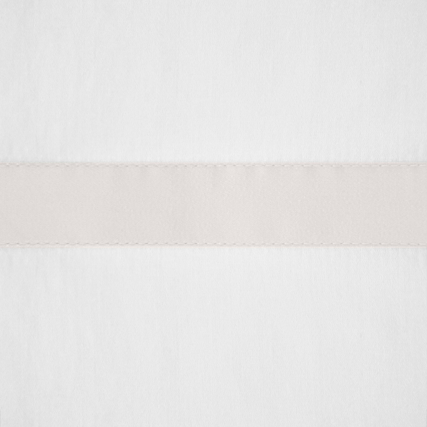 Close-up of ivory fabric with a centered ecru woven border band and scalloped edges.