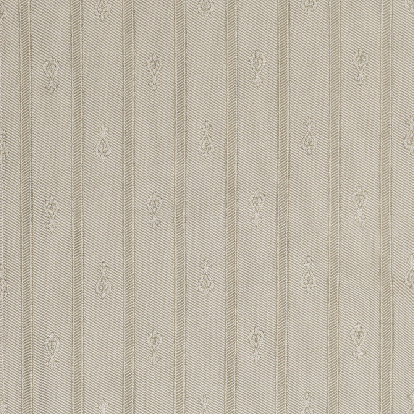 Close-up of Home Treasures Glory Allover fabric in taupe with stripe and medallion embroidery.