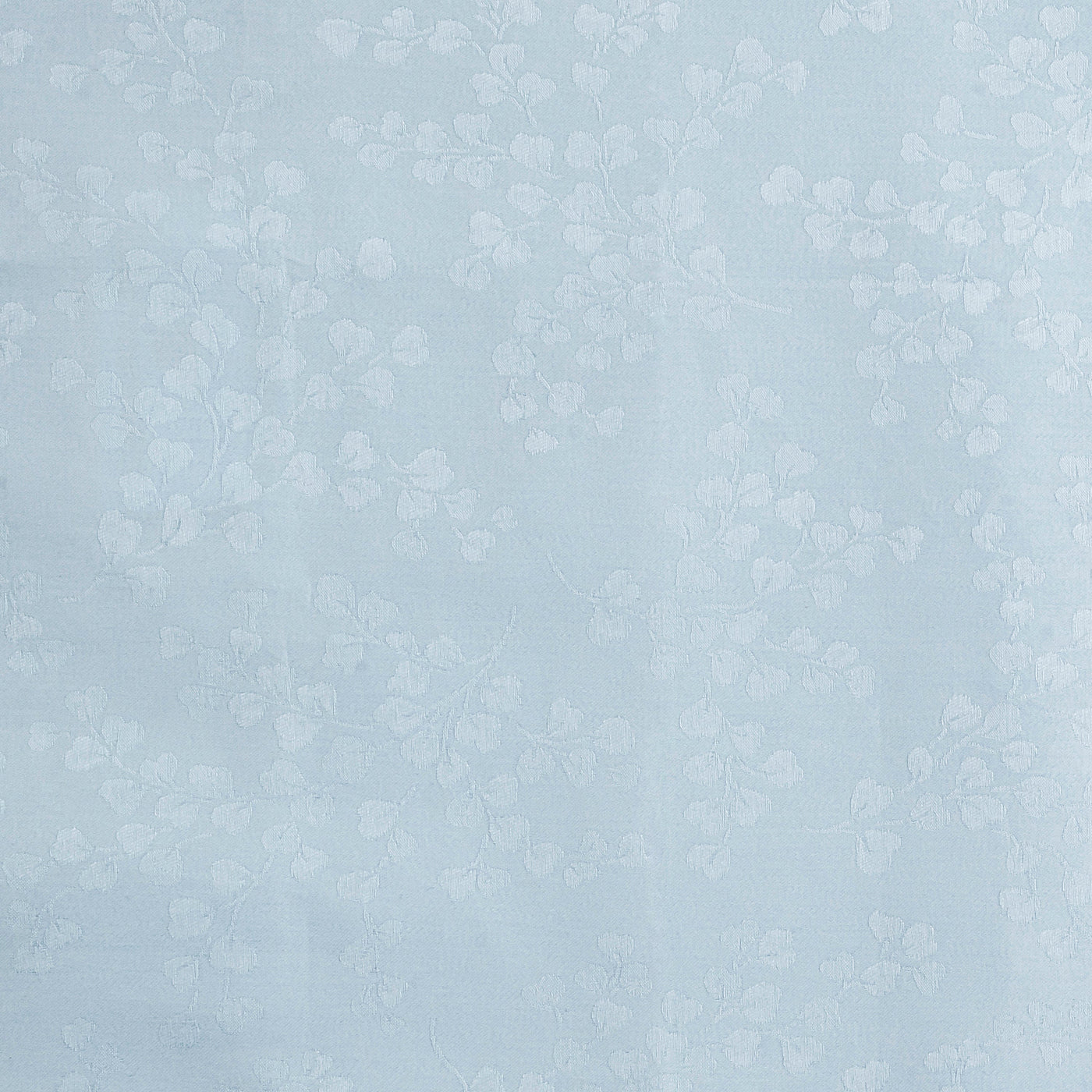 Close-up of powder blue damask fabric with tone-on-tone woven ivy leaf pattern.