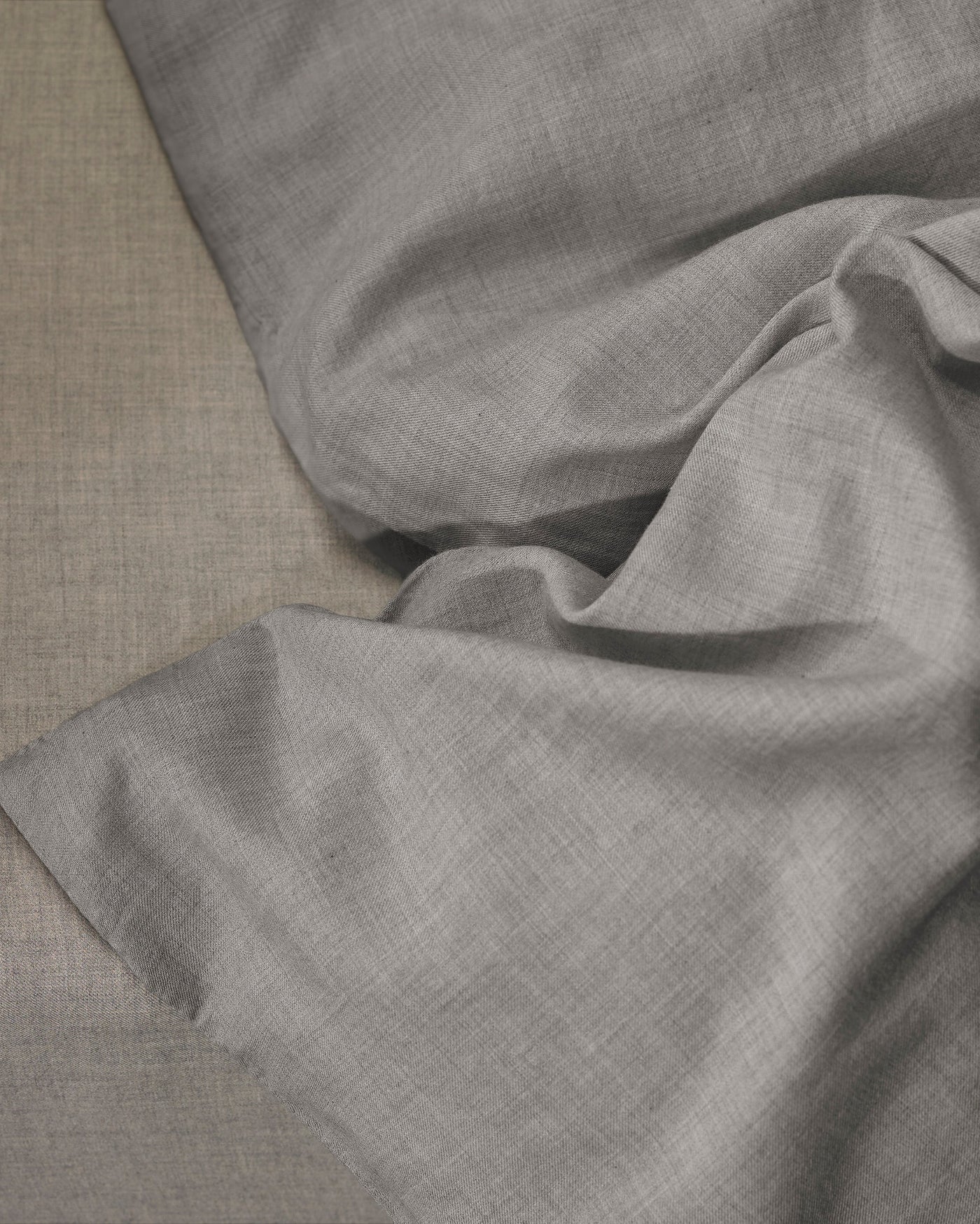 Close-up of Society Limonta Smir duvet cover in dove grey linen weave texture.