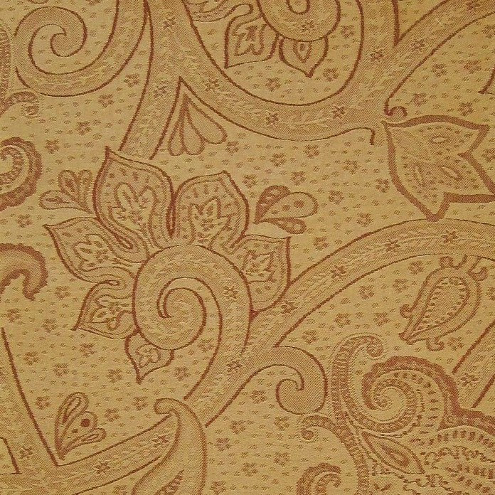 Close-up of golden amber jacquard weave with intricate paisley and floral pattern.