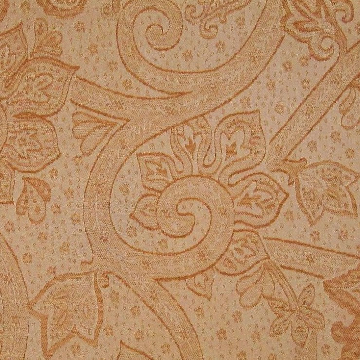 Close-up of champagne jacquard fabric with tonal floral and scroll damask weave.
