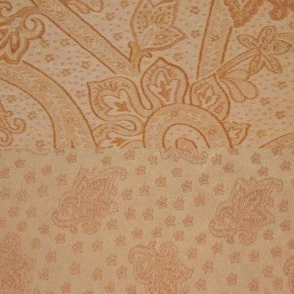 Close-up of Home Treasures Kashan duvet cover jacquard weave in champagne and gold.