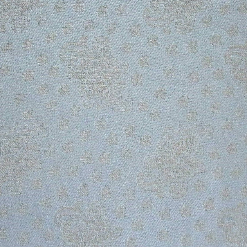 Close-up of Home Treasures Kashan fabric in powder blue with champagne paisley jacquard weave.