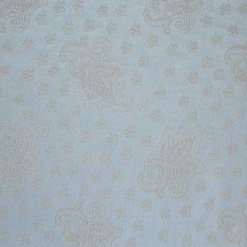 Close-up of powder blue fabric with tonal champagne paisley jacquard weave.