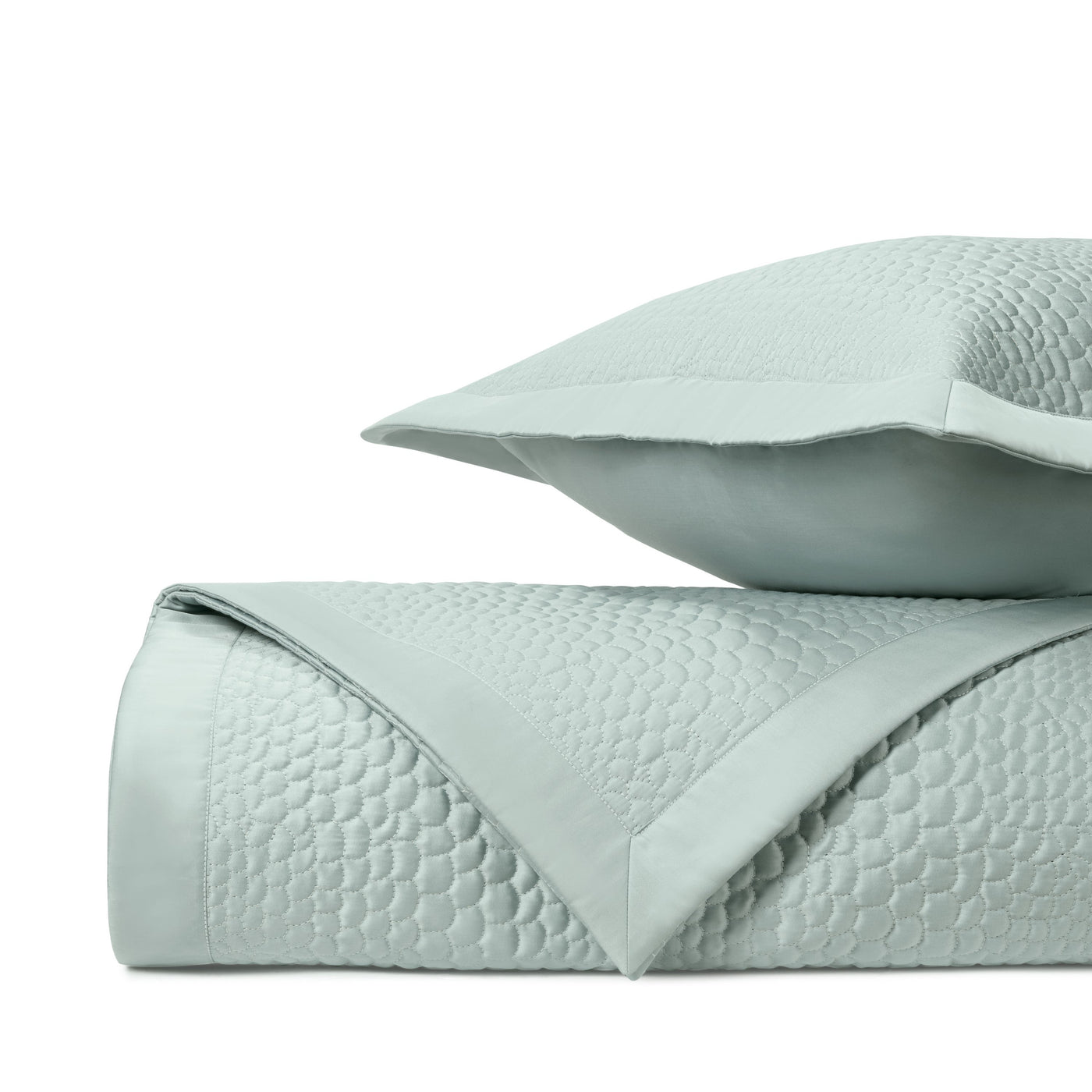 Honeycomb quilted texture detail on Home Treasures Komodo coverlet in mist blue.