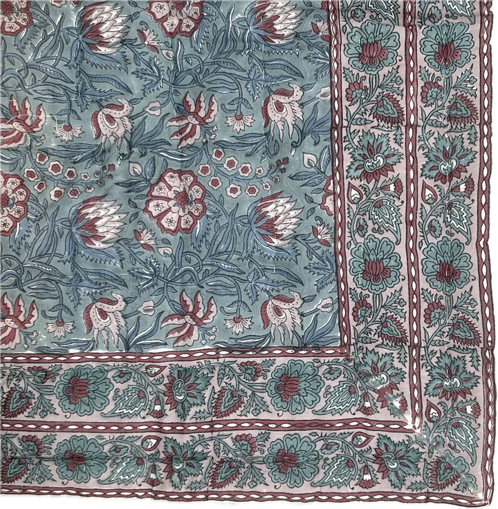 Sage and burgundy block-print floral pattern with decorative border detail.