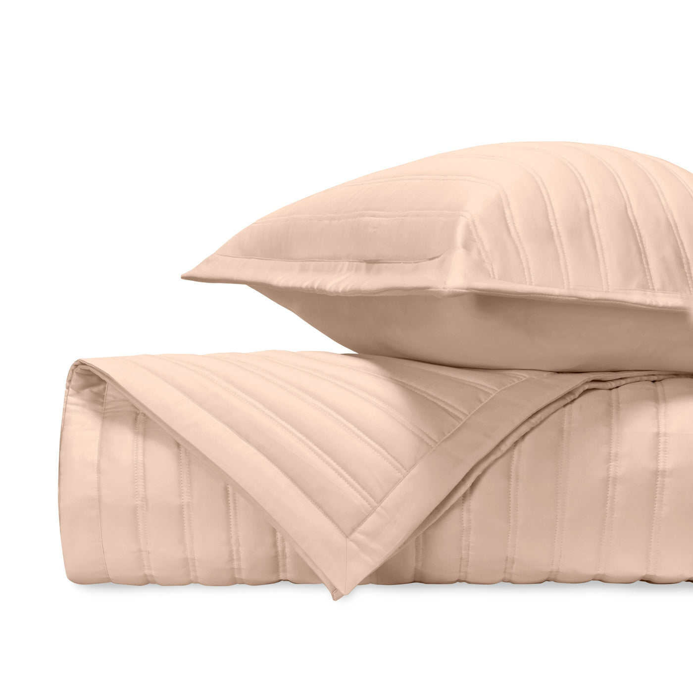 Blush quilted texture detail showing parallel channel stitching on satin cotton.
