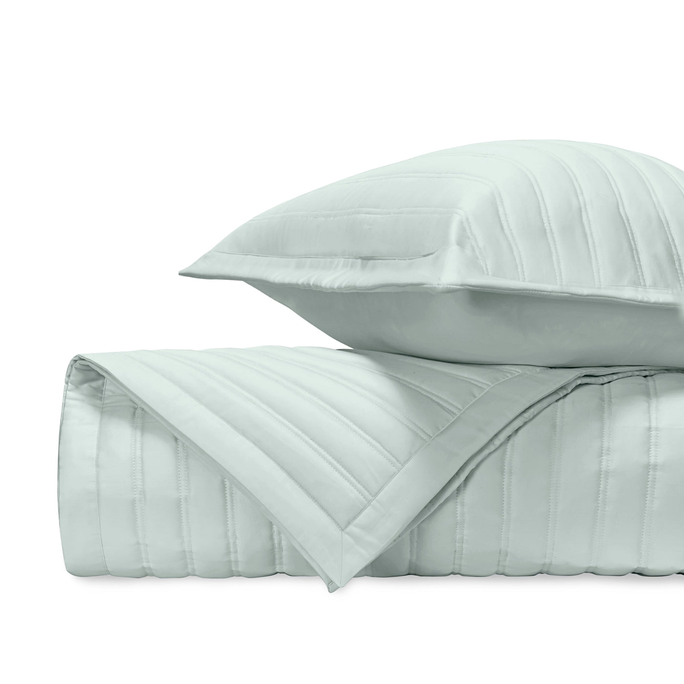 Close-up of L'Avenue quilted satin in mist, showing parallel channel stitching detail.