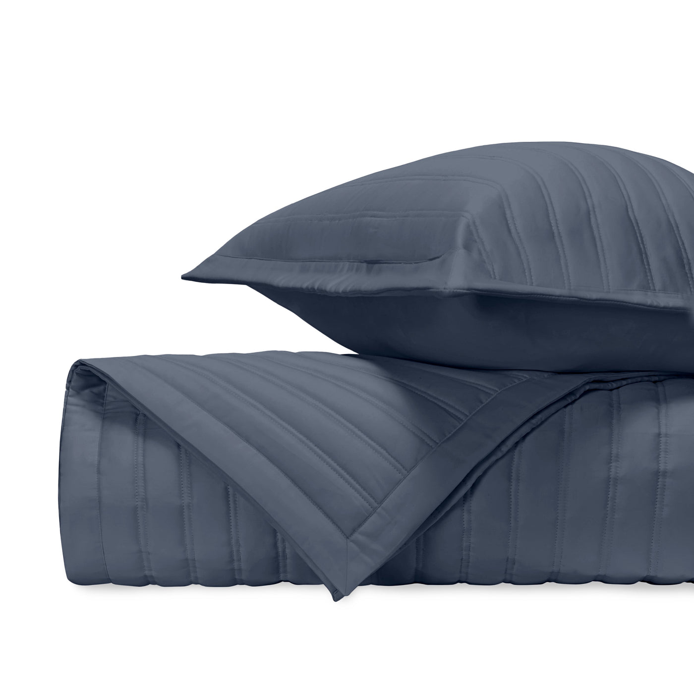 Close-up of Home Treasures L'Avenue quilted coverlet in navy with channel stitching detail.