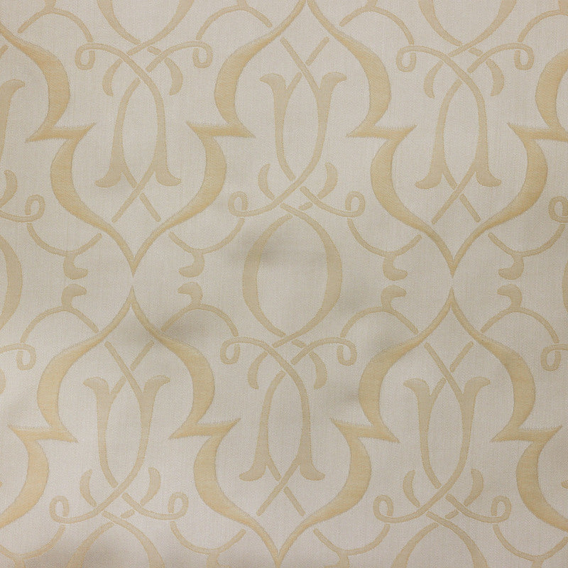 Close-up of Legna Agadir bedskirt fabric in ivory with champagne damask medallion pattern.