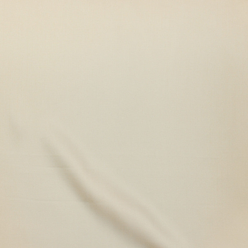 Ivory fabric draped softly, showing smooth matte surface texture.