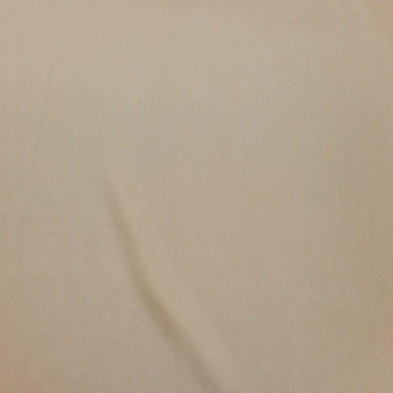 Close-up of Legna Classic decorative pillow in sand, showing smooth fabric texture with soft drape.