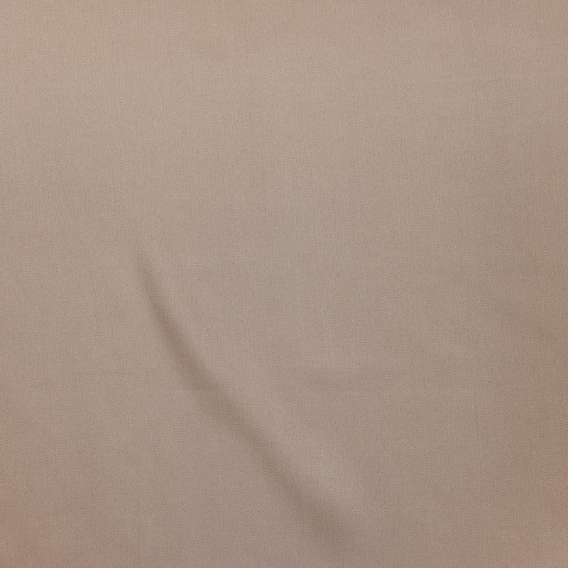 Close-up of draped taupe Legna Classic fabric showing smooth weave texture.
