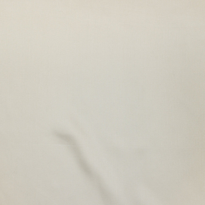 Close-up of ivory fabric with subtle drape and fine woven texture.