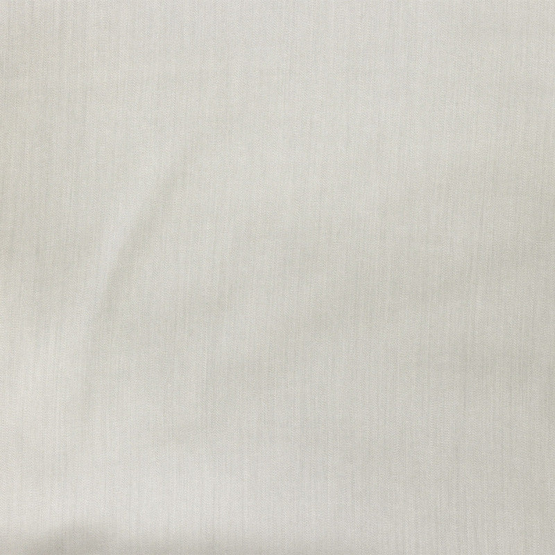 Close-up of ivory woven fabric with subtle vertical texture and soft drape.