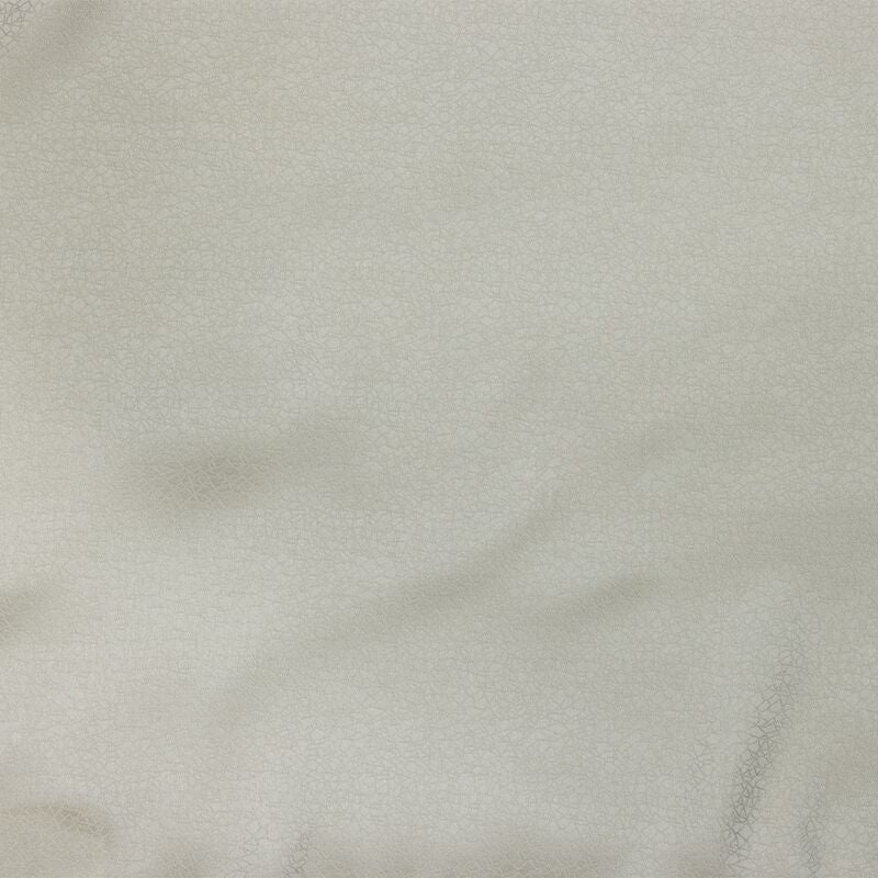 Close-up of draped ivory Legna Prieta flat sheet fabric showing subtle sheen and soft folds.
